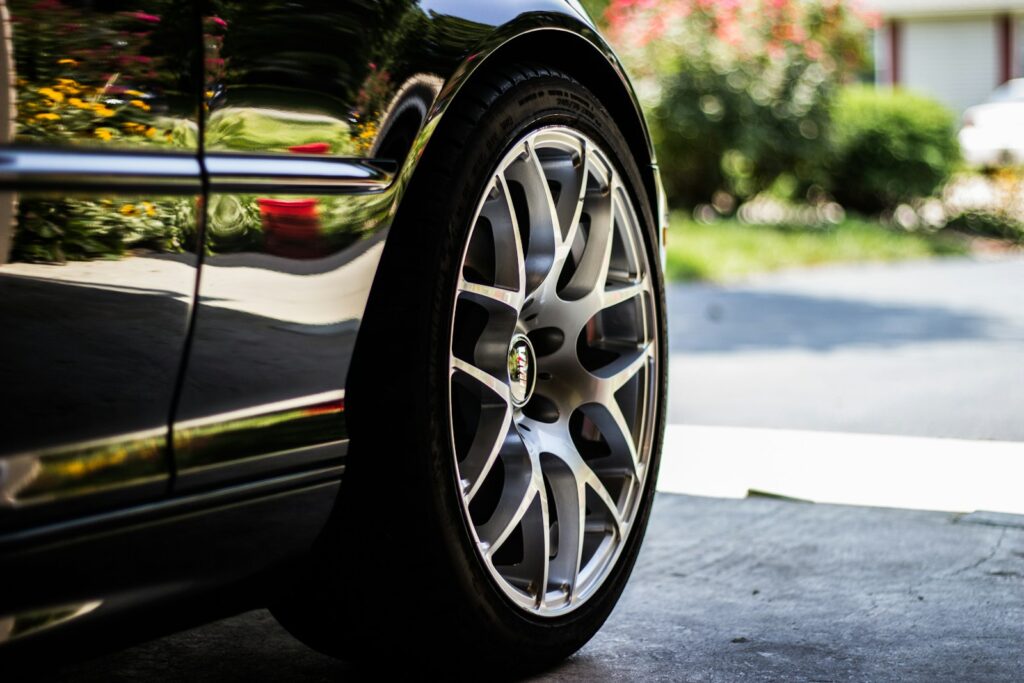 gray vehicle rim with tire how often should you wax your car