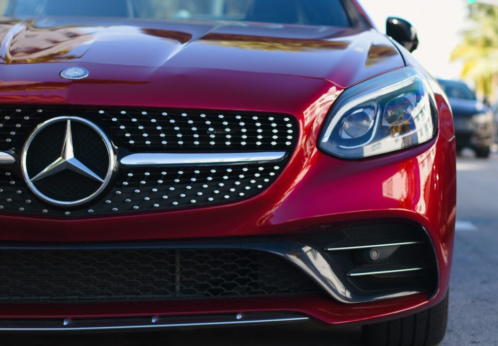 How Often Should You Wax Your Car for Optimal Shine and Protection? 3 red mercedes benz car with black and white cat