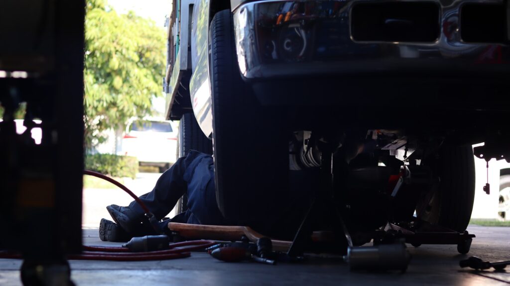 Undercarriage Car Wash: The Ultimate Guide to Protecting Your Vehicle 3 a man working on a vehicle under a truck