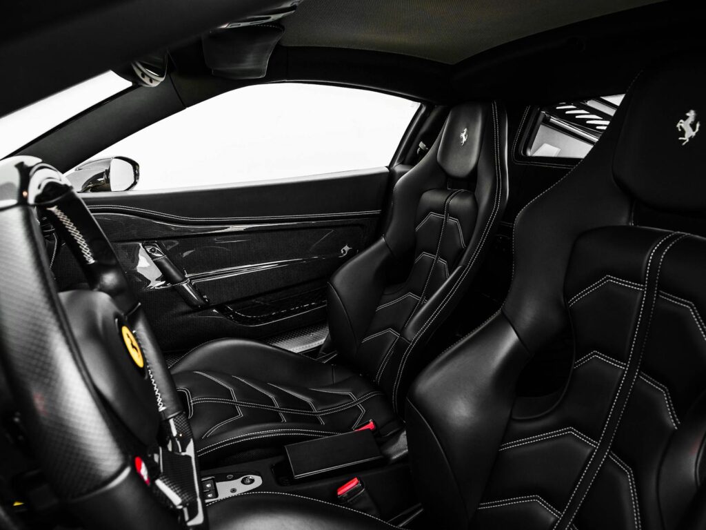 Explore the sleek black leather interior and cutting-edge design of a Ferrari 488 Speciale.