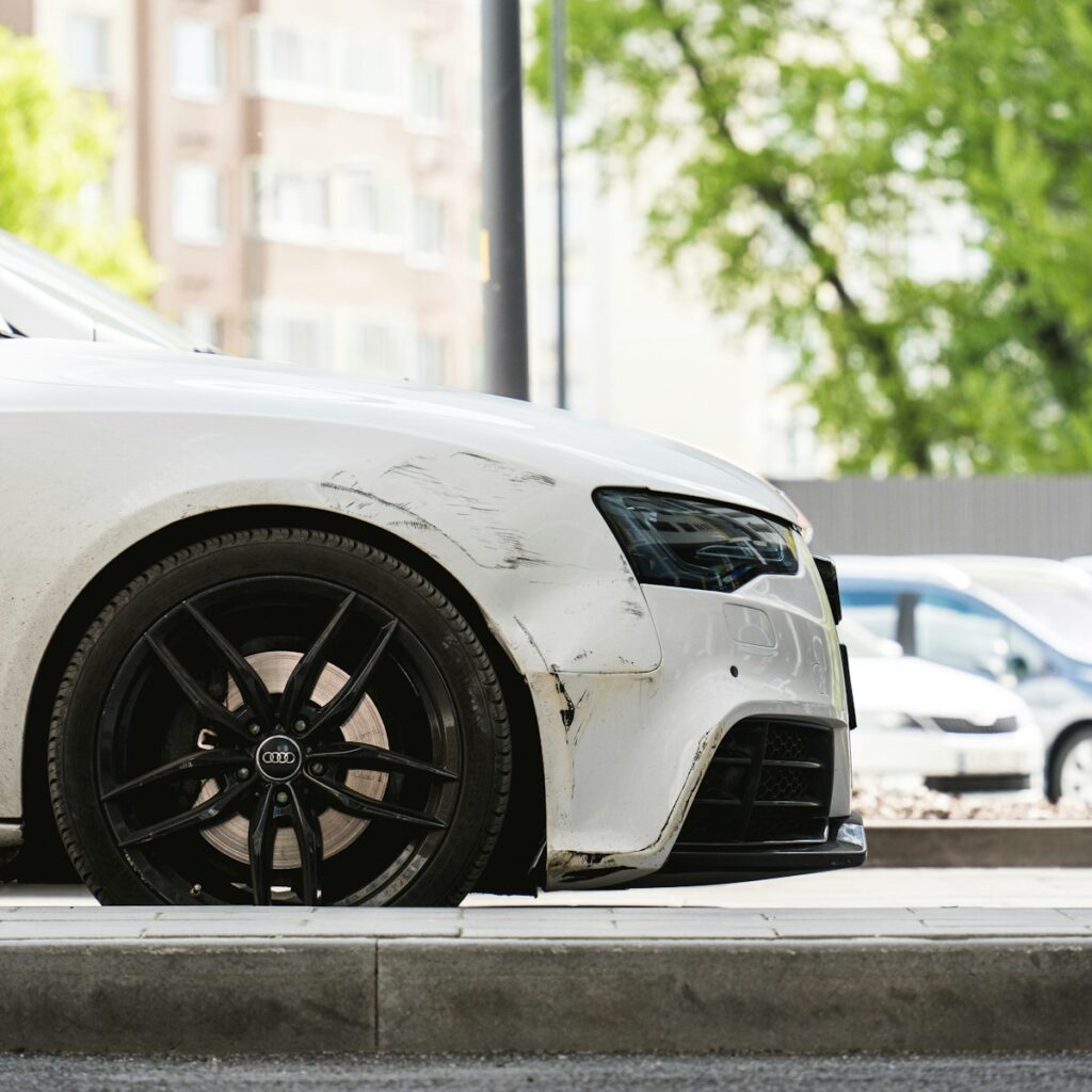a white car parked on the side of the road