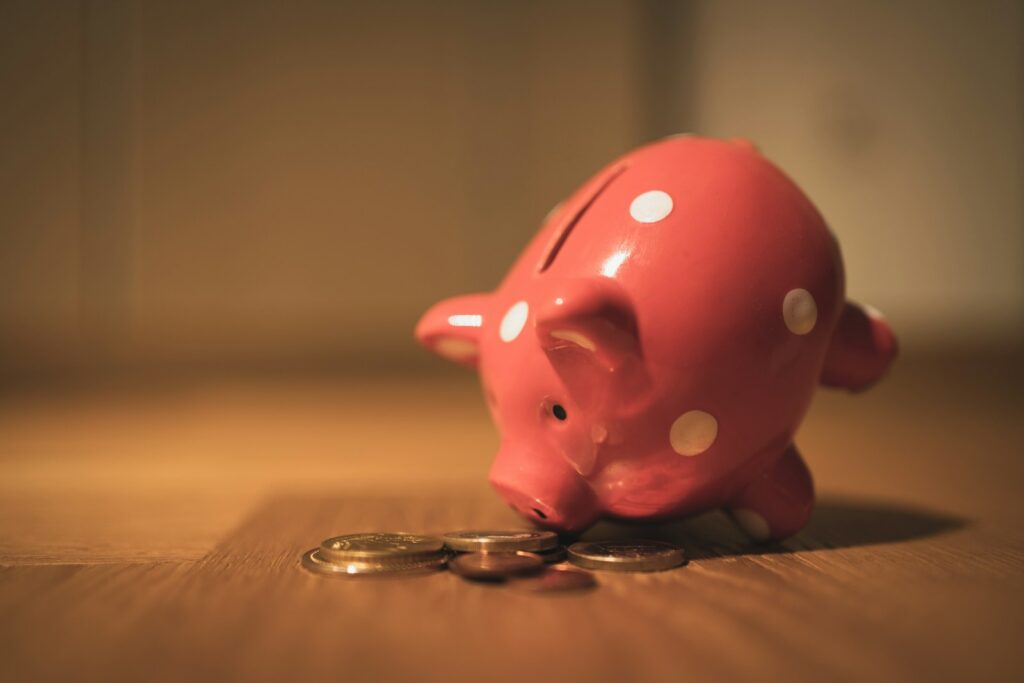 5 Game-Changing Perks of a Fusion Car Wash Membership 1 pink pig coin bank on brown wooden table