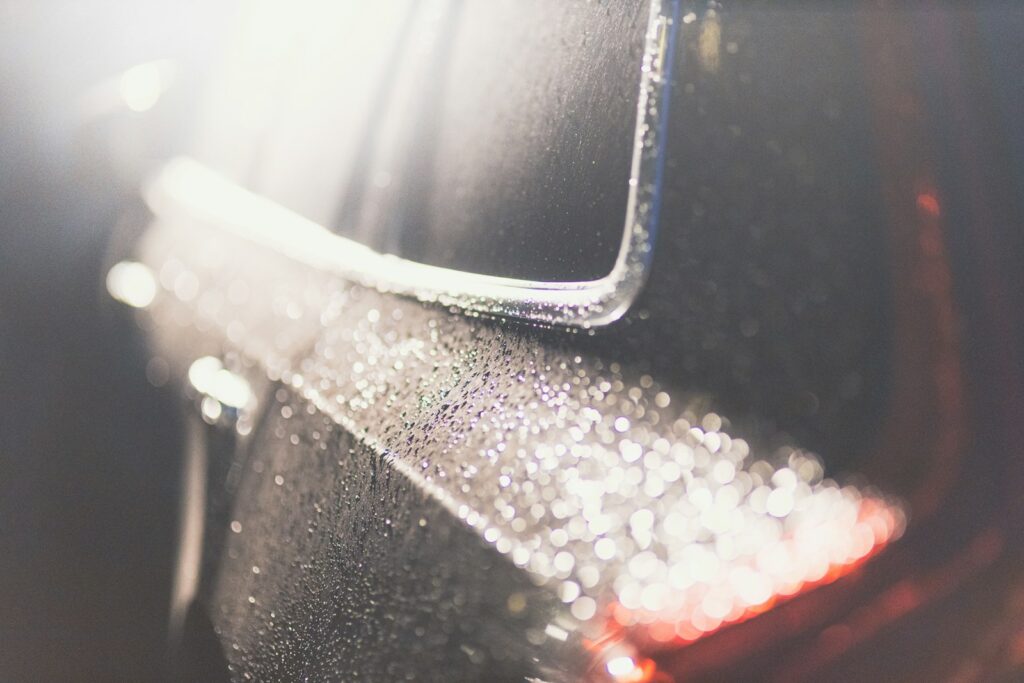 Close up of water droplets on a dark surface