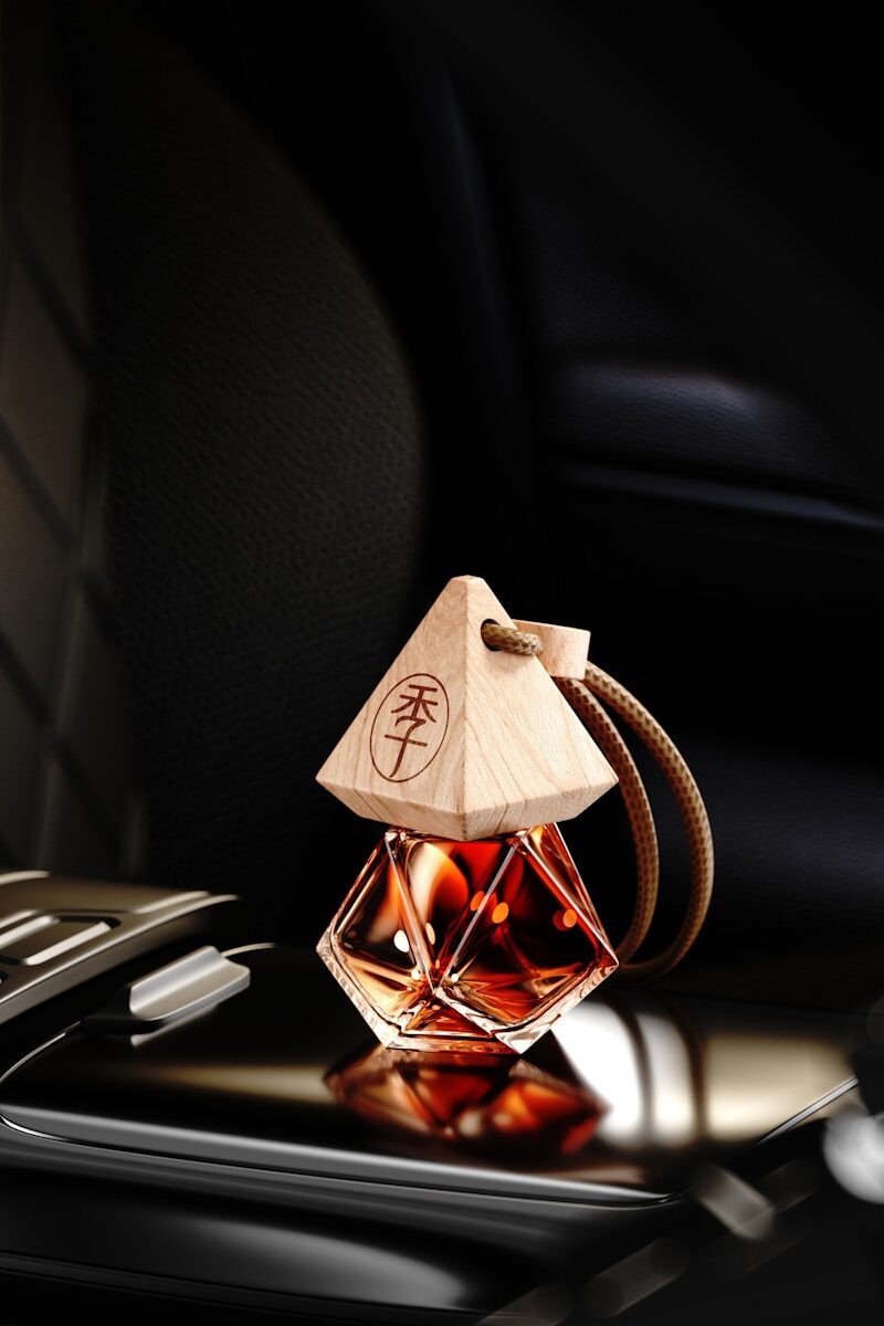 A pyramid-shaped car air freshener with liquid inside