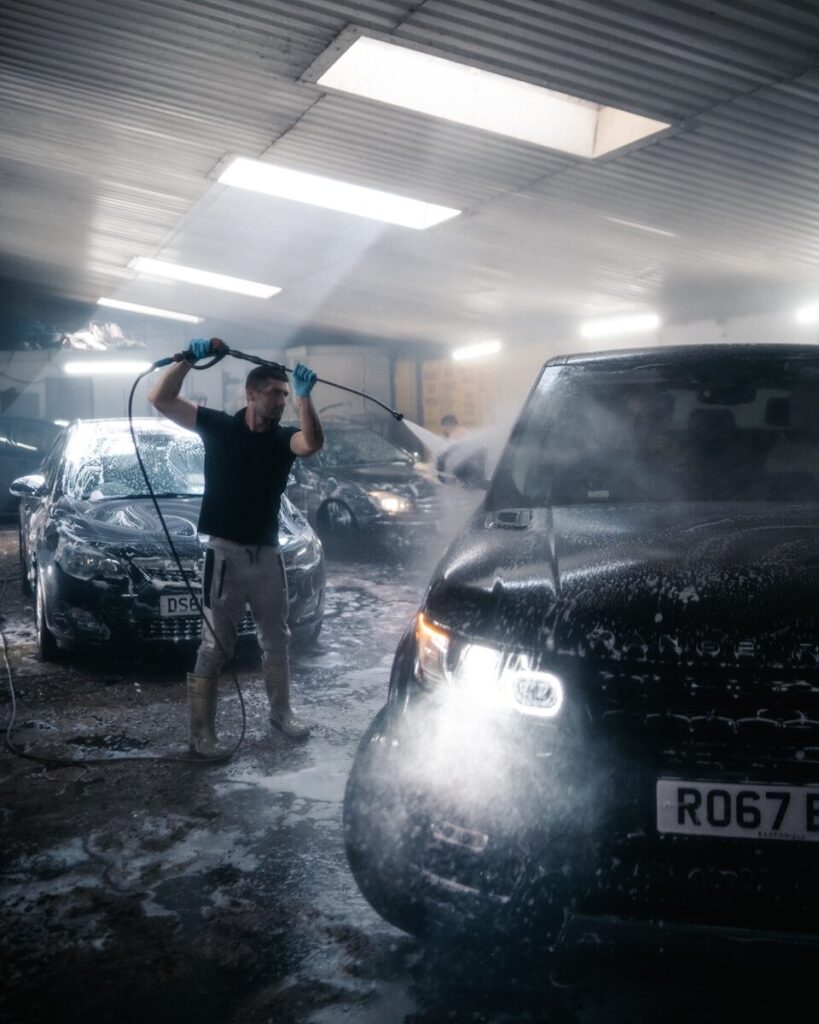 a person standing next to a car