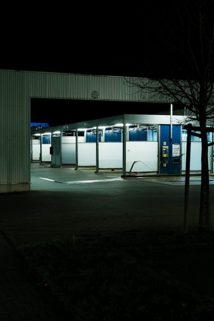 Self Car Wash vs Fusion Car Wash | Who Will Shine Brighter? 3 Empty car wash stalls at night