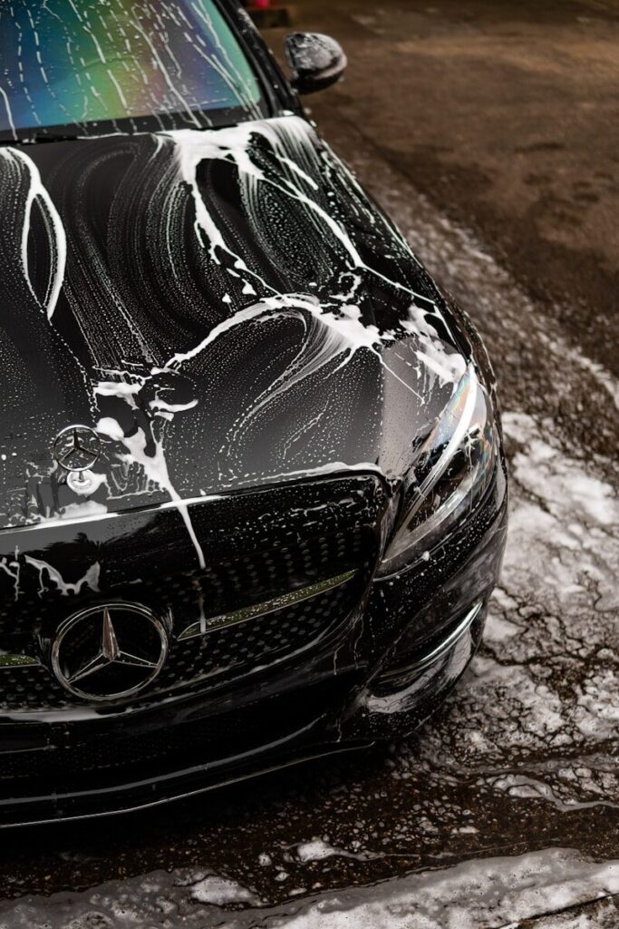 Car Wash Soap in Frederick, Maryland Explained: What It Is, What to Use, and What to Avoid 2 Black car covered in soap suds during wash.